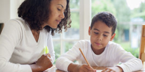 mother with son doing homework